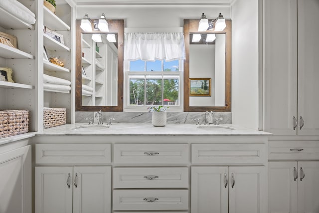 bathroom featuring double vanity and a sink