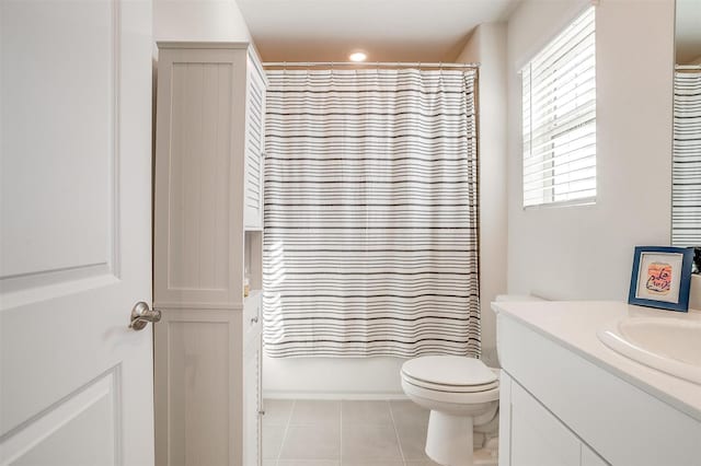 full bathroom featuring toilet, shower / tub combo with curtain, tile patterned flooring, and vanity