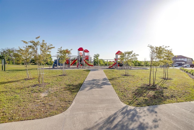 community play area with a lawn