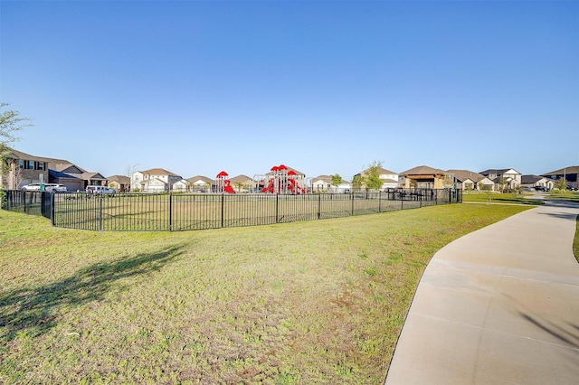 view of yard with fence and a residential view