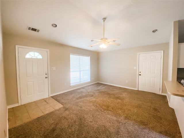 502 E Ross St, Waxahachie, TX 75165 - foyer with carpet floors, baseboards, a ceiling fan, and visible vents