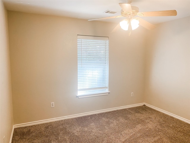 502 E Ross St, Waxahachie, TX 75165 - carpeted spare room featuring ceiling fan, baseboards, and visible vents