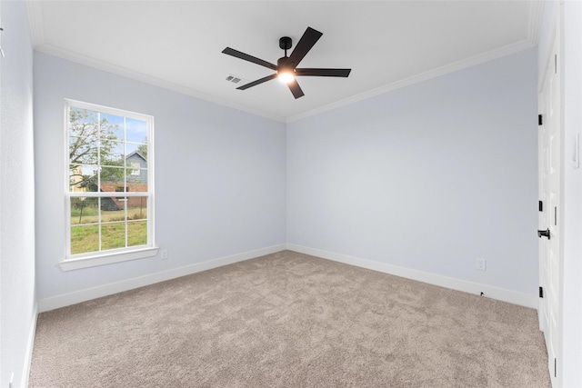 carpeted empty room featuring crown molding, baseboards, and visible vents