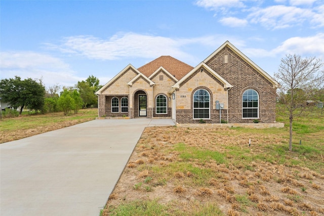 view of front of house with brick siding