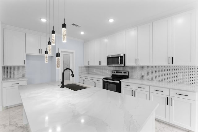 kitchen featuring white cabinets, visible vents, appliances with stainless steel finishes, marble finish floor, and a sink