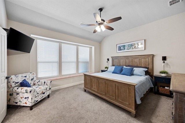 bedroom with light carpet, baseboards, visible vents, a ceiling fan, and lofted ceiling