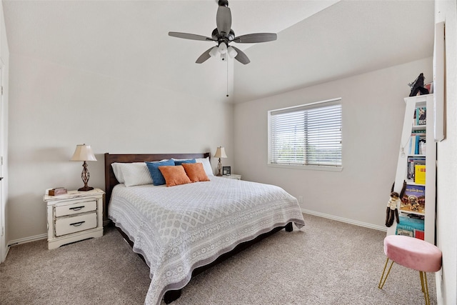 carpeted bedroom with baseboards, a ceiling fan, and lofted ceiling
