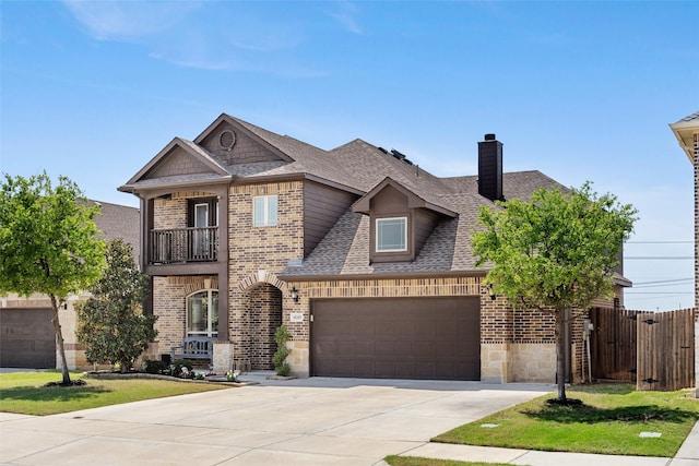 view of front of property featuring a shingled roof, brick siding, a chimney, concrete driveway, and fence
