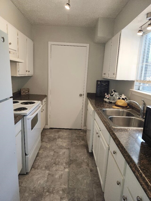 4614 Country Creek Dr Unit 1167, Dallas, TX 75236 - kitchen featuring a sink, dark countertops, white cabinetry, white appliances, and under cabinet range hood