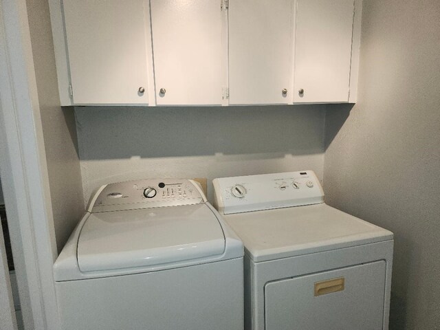 4614 Country Creek Dr Unit 1167, Dallas, TX 75236 - clothes washing area with cabinet space and independent washer and dryer