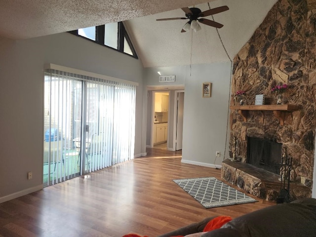 4614 Country Creek Dr Unit 1167, Dallas, TX 75236 - living room featuring high vaulted ceiling, baseboards, wood finished floors, and ceiling fan