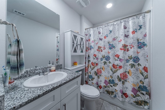 bathroom featuring toilet, vanity, shower / bath combination with curtain, and visible vents