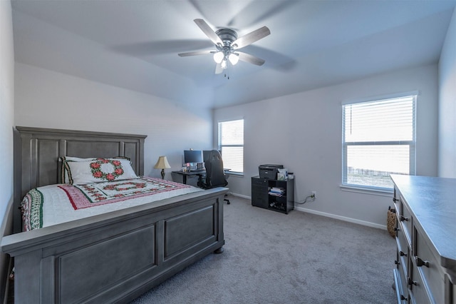 bedroom featuring light carpet, baseboards, and a ceiling fan