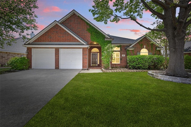 5320 Big Bend Dr, Fort Worth, TX 76137 - view of front of property with an attached garage, a yard, concrete driveway, and brick siding