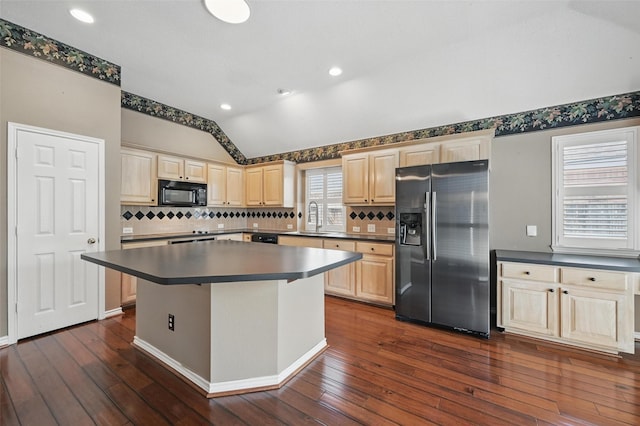 5320 Big Bend Dr, Fort Worth, TX 76137 - kitchen with light brown cabinetry, a sink, lofted ceiling, and black appliances