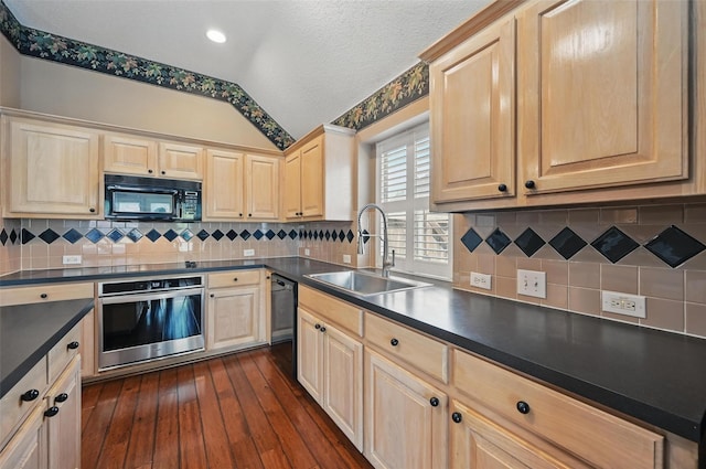 5320 Big Bend Dr, Fort Worth, TX 76137 - kitchen with light brown cabinets, a sink, dark countertops, black appliances, and lofted ceiling