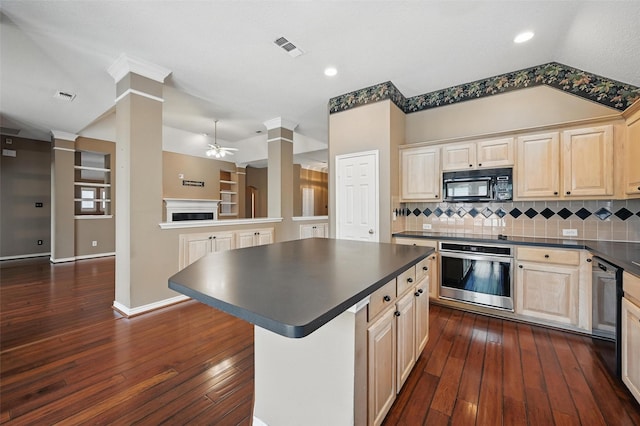 5320 Big Bend Dr, Fort Worth, TX 76137 - kitchen featuring dark countertops, black microwave, light brown cabinetry, and stainless steel oven