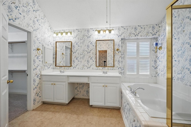 5320 Big Bend Dr, Fort Worth, TX 76137 - full bath with a sink, a bath, tile patterned flooring, and wallpapered walls