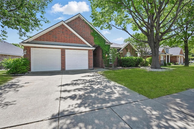 5320 Big Bend Dr, Fort Worth, TX 76137 - view of front facade with concrete driveway, a front yard, brick siding, and a garage