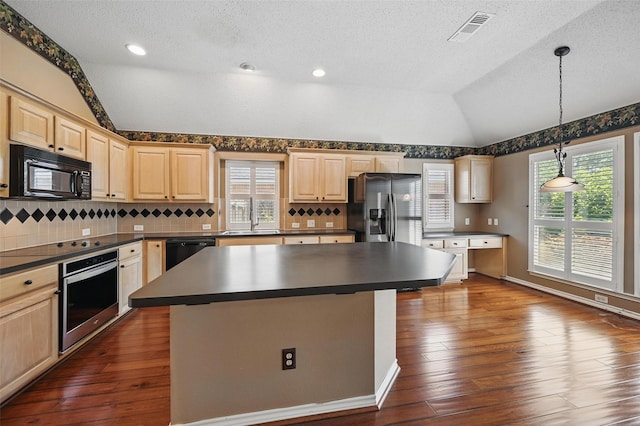 5320 Big Bend Dr, Fort Worth, TX 76137 - kitchen with dark countertops, black appliances, light brown cabinetry, and lofted ceiling