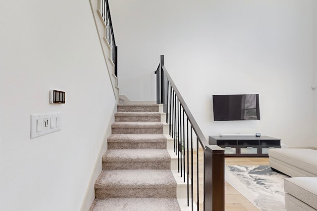 2812 Bluejack Rd, Mckinney, TX 75071 - stairway with wood finished floors and baseboards