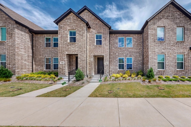2812 Bluejack Rd, Mckinney, TX 75071 - view of front of house with brick siding and a front lawn