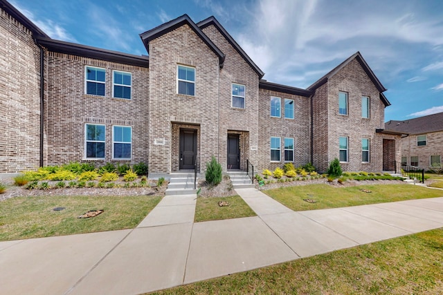 2812 Bluejack Rd, Mckinney, TX 75071 - townhome / multi-family property featuring brick siding and a front lawn