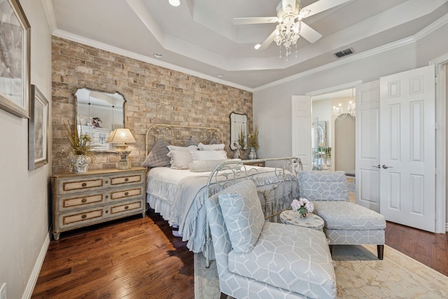 1318 Amsterdam Ct, Granbury, TX 76048 - bedroom with a tray ceiling, wood finished floors, baseboards, a ceiling fan, and brick wall