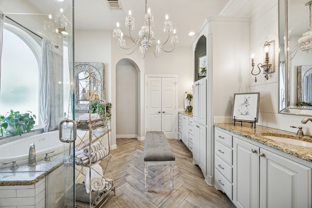 1318 Amsterdam Ct, Granbury, TX 76048 - full bath with vanity, a bathtub, and a chandelier