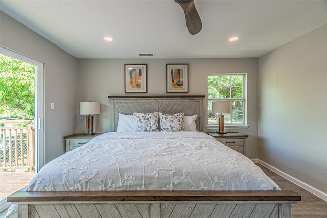 bedroom featuring visible vents, baseboards, recessed lighting, wood finished floors, and access to exterior