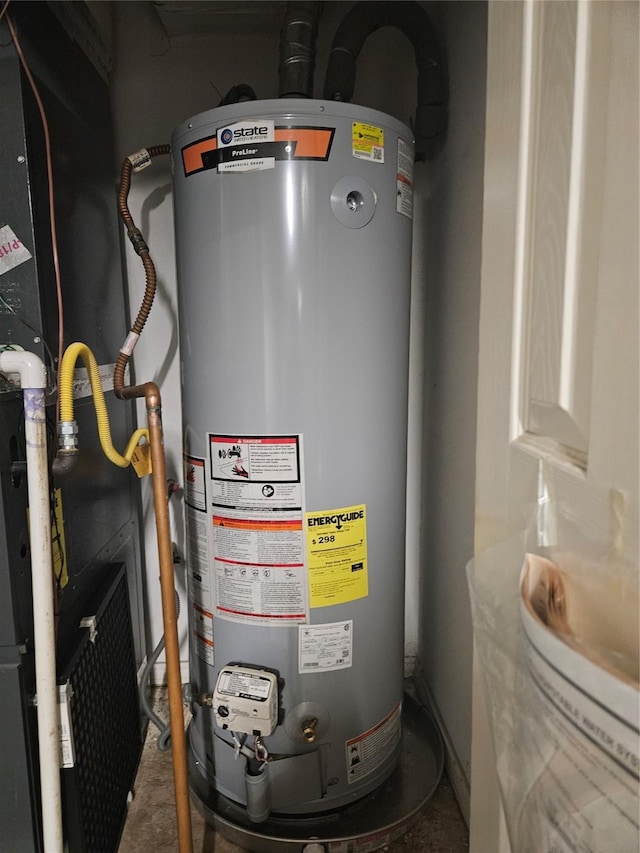 utility room with heating unit and gas water heater