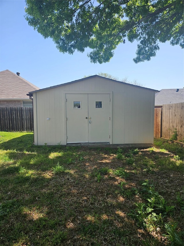 view of shed featuring a fenced backyard