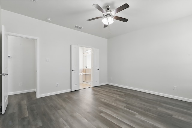 unfurnished bedroom with dark wood-type flooring, baseboards, a ceiling fan, and visible vents
