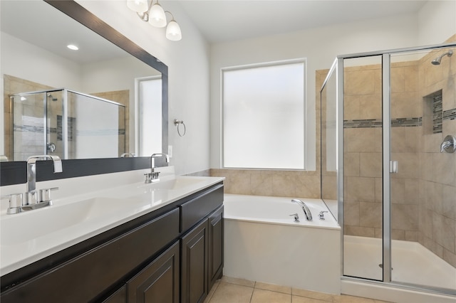 bathroom featuring double vanity, a bath, a sink, and a stall shower
