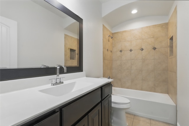 bathroom featuring vanity, toilet, tile patterned flooring, and  shower combination