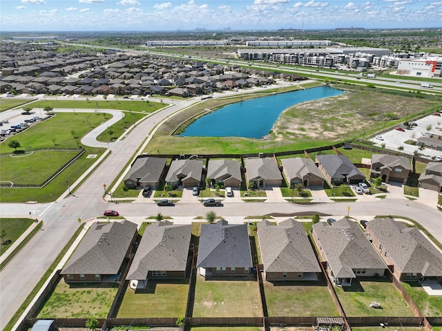 bird's eye view featuring a residential view and a water view
