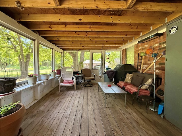 sunroom / solarium featuring outdoor lounge area