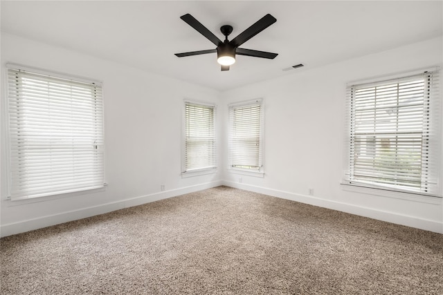 1507 Newport Ave, Dallas, TX 75224 - carpeted empty room with ceiling fan, baseboards, a healthy amount of sunlight, and visible vents