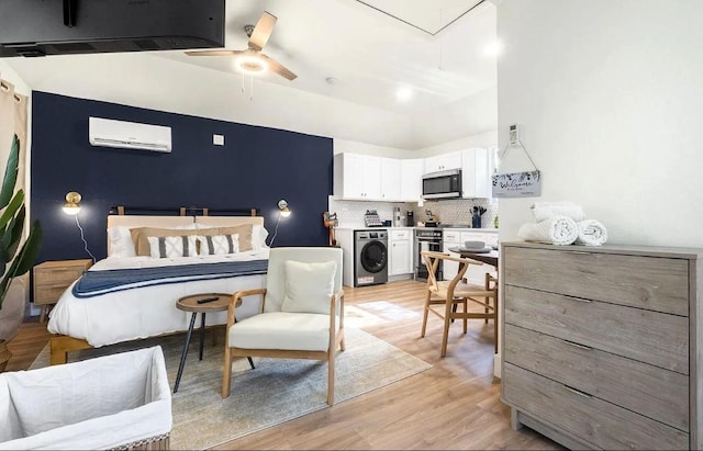 1507 Newport Ave, Dallas, TX 75224 - bedroom with light wood-type flooring, attic access, a wall mounted AC, and washer / clothes dryer