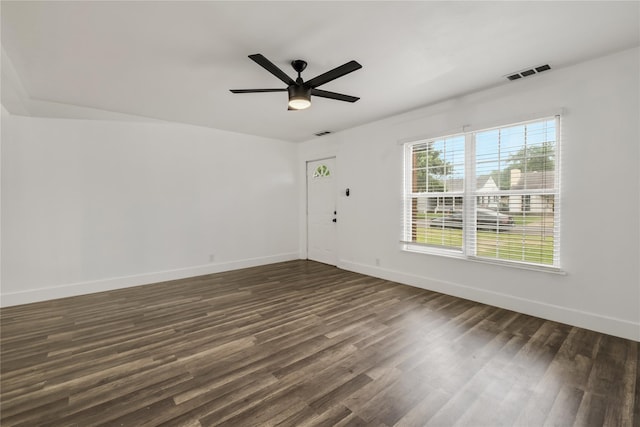1507 Newport Ave, Dallas, TX 75224 - unfurnished room featuring visible vents, a ceiling fan, baseboards, and dark wood-style flooring