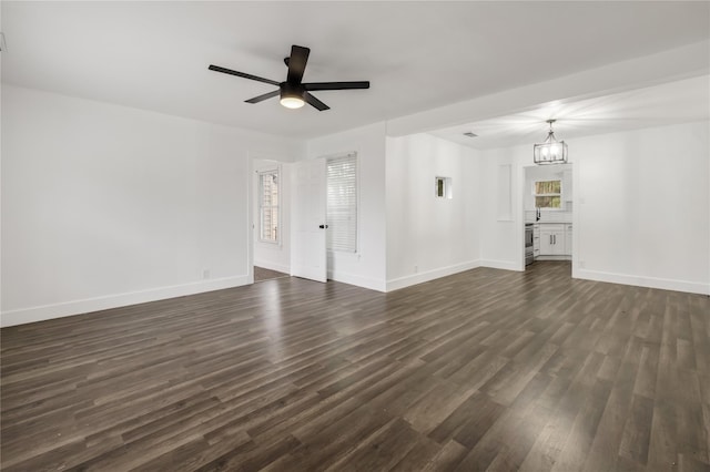 1507 Newport Ave, Dallas, TX 75224 - unfurnished living room with visible vents, a ceiling fan, baseboards, and dark wood-type flooring