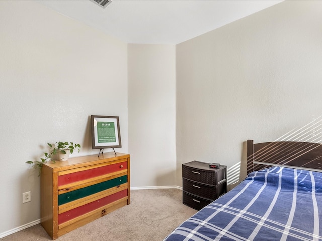 carpeted bedroom featuring baseboards