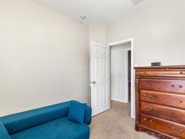 living area with light colored carpet