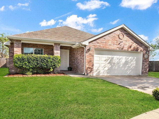 single story home with brick siding, an attached garage, a front lawn, and driveway