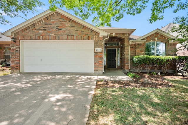 2833 Spotted Owl Dr, Fort Worth, TX 76244 - single story home with concrete driveway, an attached garage, and brick siding