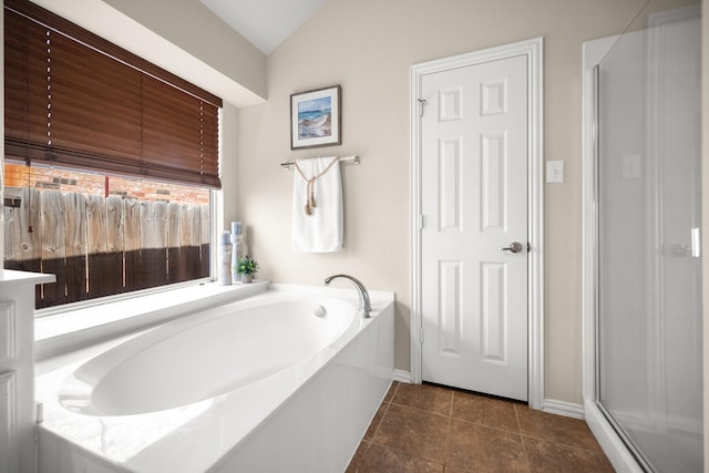 2833 Spotted Owl Dr, Fort Worth, TX 76244 - full bath featuring a bath, vaulted ceiling, baseboards, and tile patterned flooring
