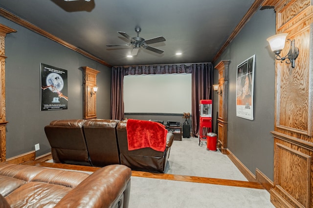 carpeted cinema room featuring decorative columns, baseboards, recessed lighting, ceiling fan, and crown molding
