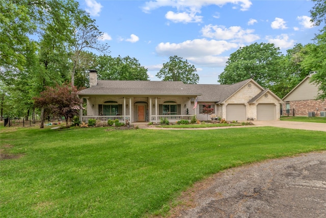 single story home with a chimney, driveway, covered porch, an attached garage, and a front yard