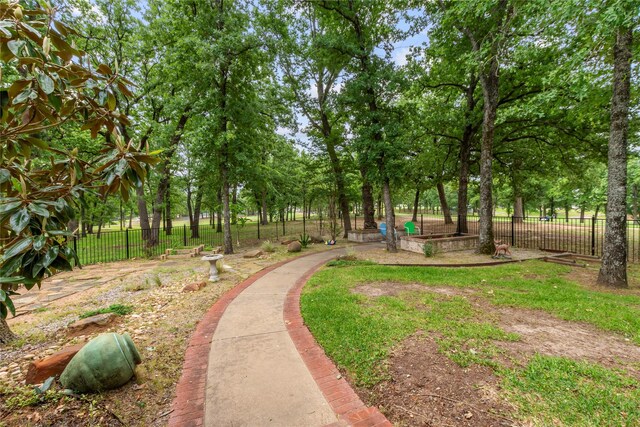 view of community featuring fence
