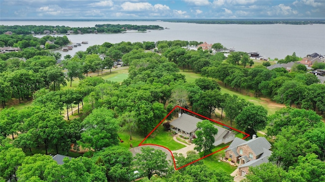 drone / aerial view with a residential view and a water view